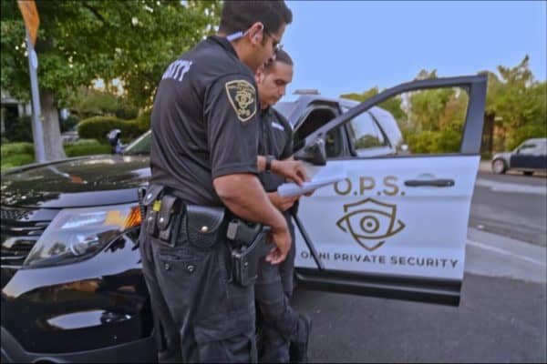 2 armed OPSinc guards opening car door