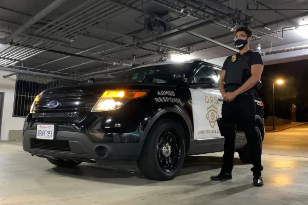 courtesy patrol officer andrew posing in front of vehicle