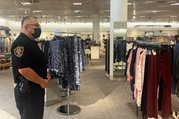 security guard from OPSInc security watching over a retail store